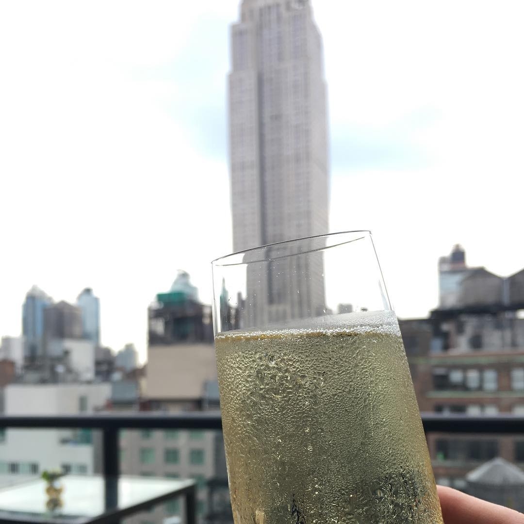 Banishing cloudy day blues with a glass of bubbly …  #rooftopbarsnyc #nyclife #n…