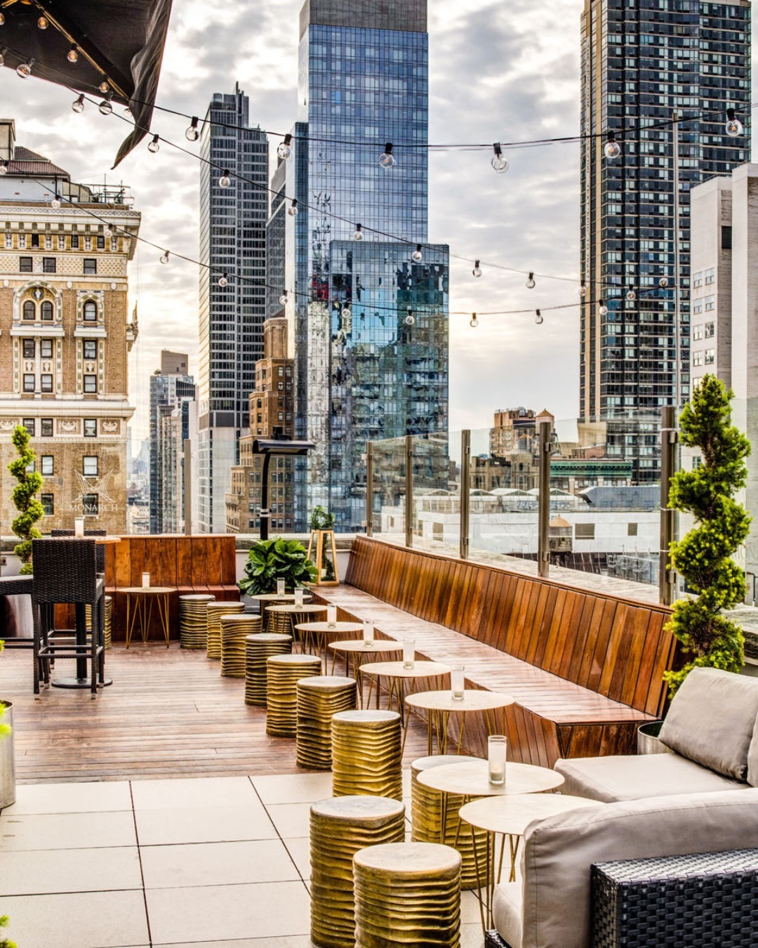Here’s to open-air escapes with a side of empire views!  #MonarchRooftop…